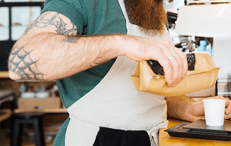 barista using coffee scale