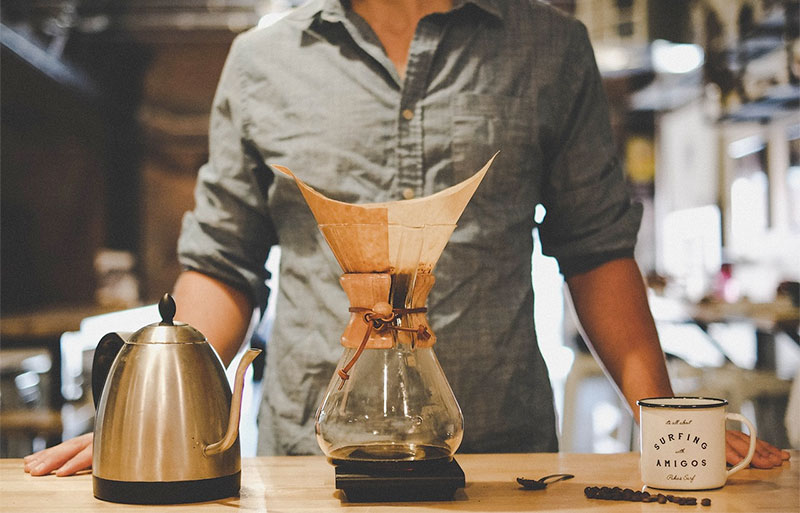 man making chemex coffee