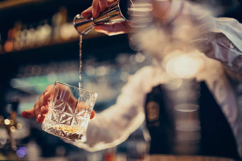 home bartender making vodka cocktails